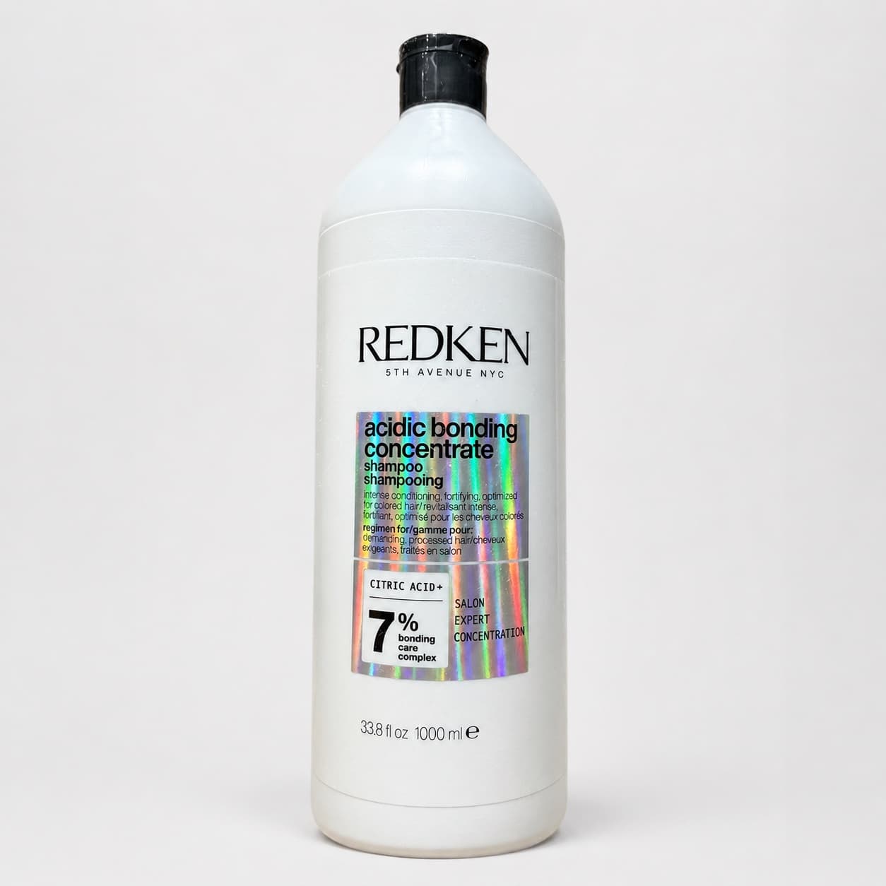 Botella blanca de Redken Acidic Bonding Concentrate Shampoo de 1000 ml